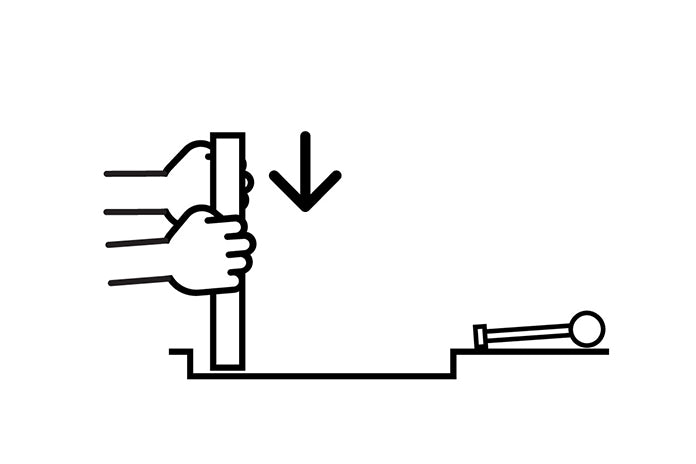 Lower the HIDE lid at a 90° position, so the side without the key slot is inserted first. Hold the HIDE lid in position with one hand at the side of the lid.