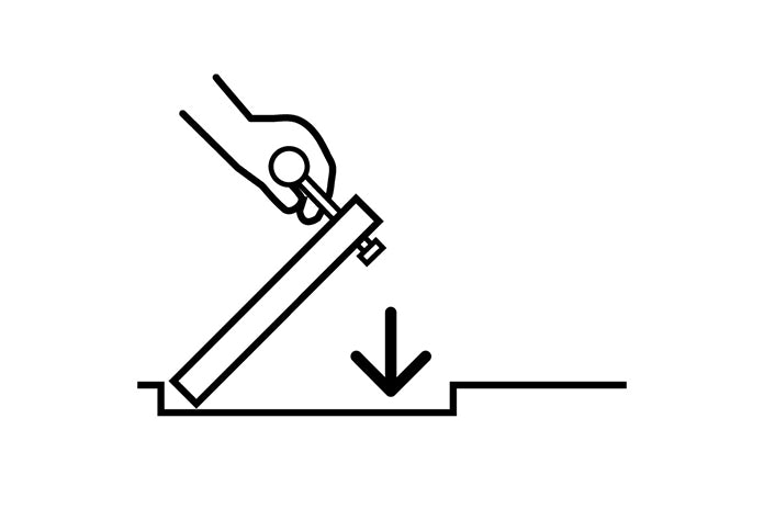 Insert the Safety Key while holding the HIDE lid in position. Move your supporting hand away and gently lower the raised edge using the Safety Key.
