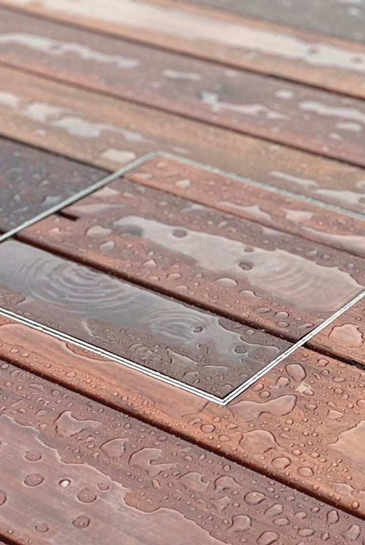 HIDE Access Cover showing decking infill after rain
