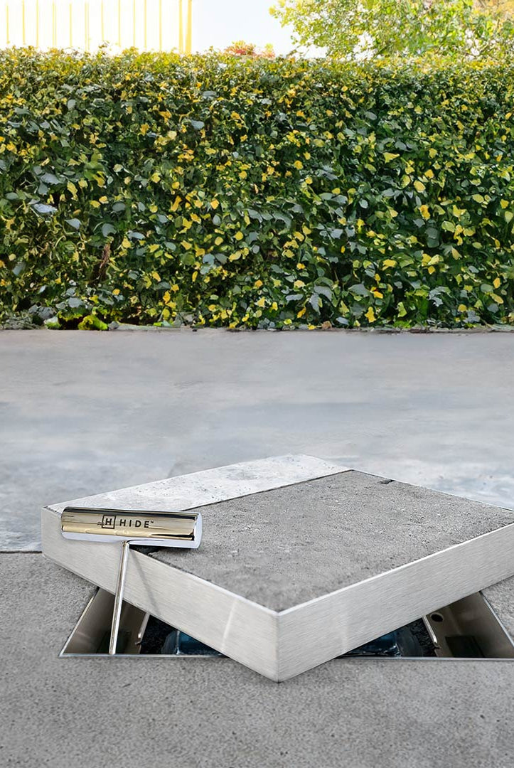 Product photo of HIDE Access Cover on top of edge protector frame with safety key