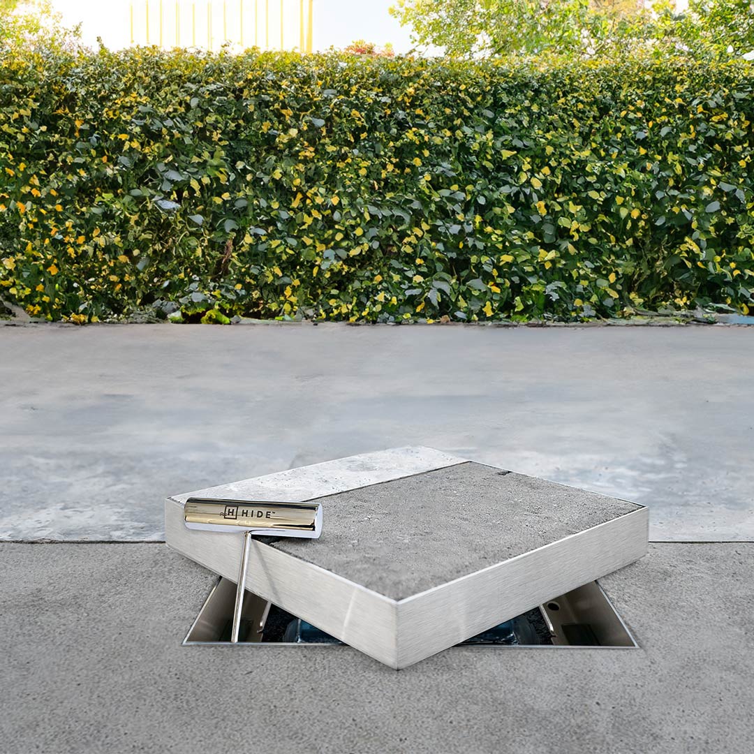 Product photo of HIDE Access Cover on top of edge protector frame with safety key