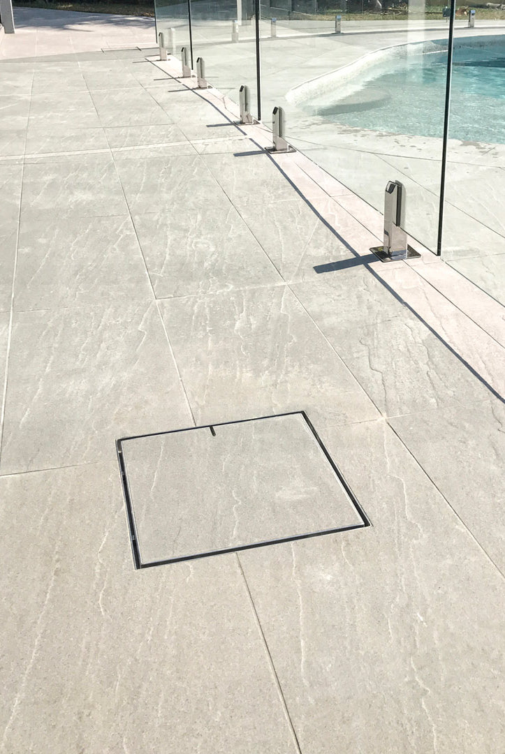 Poolside path with HIDE hatch cover