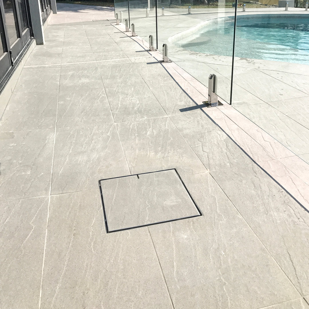 Poolside path with HIDE hatch cover