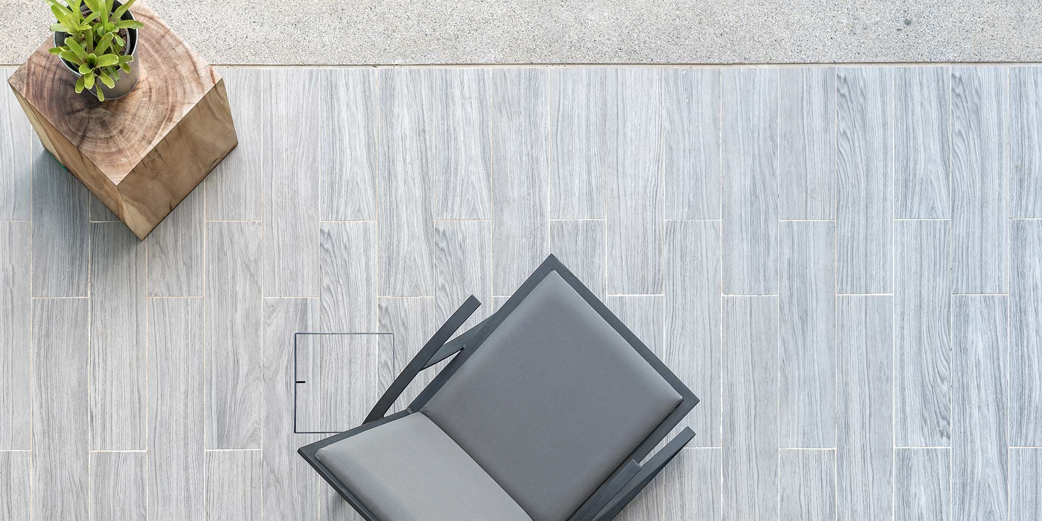 HIDE Access Cover in backyard patio, covering plastic service points, keeping the area safe and seamless.