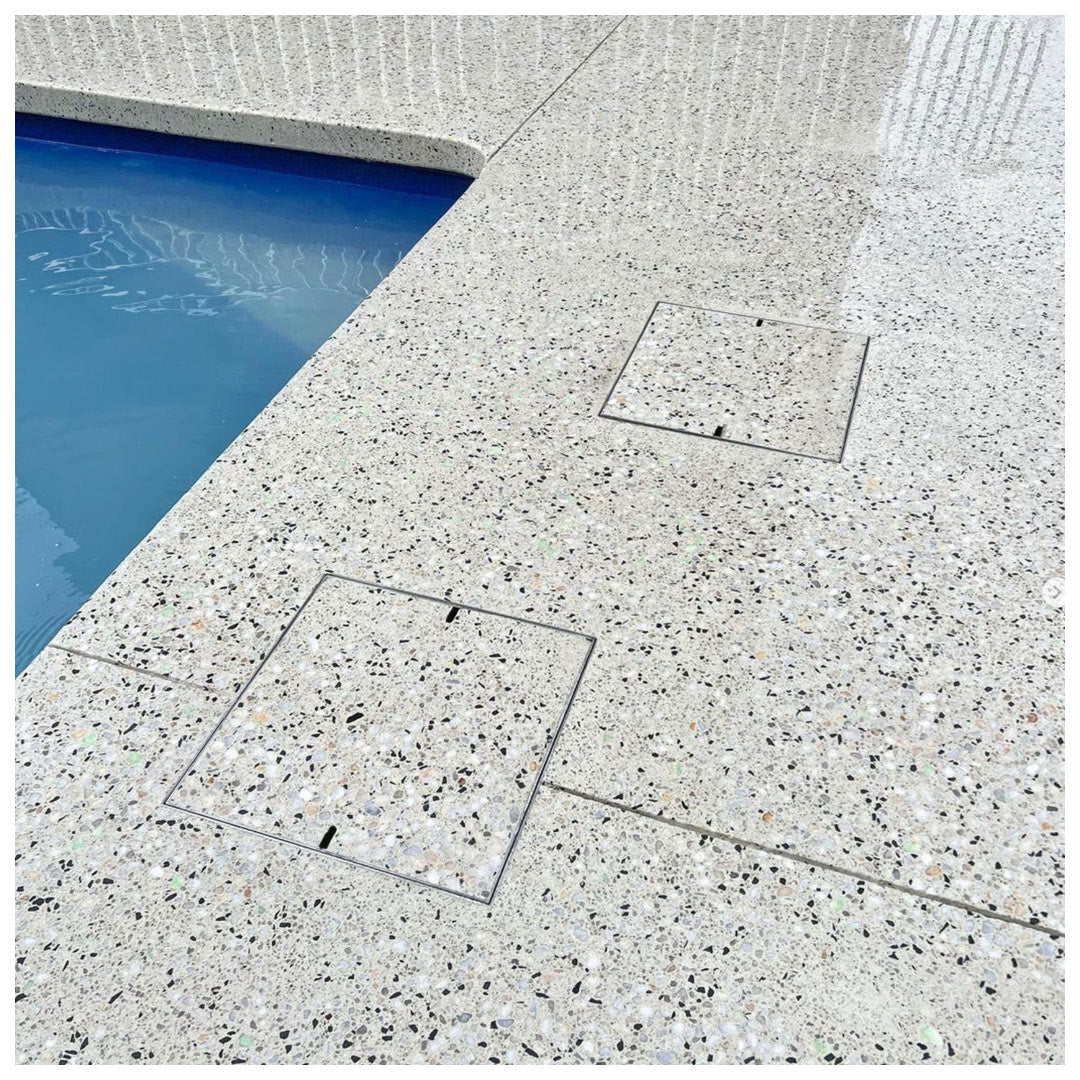 Two HIDE Concrete Skimmer Covers with exposed honed concrete finish.