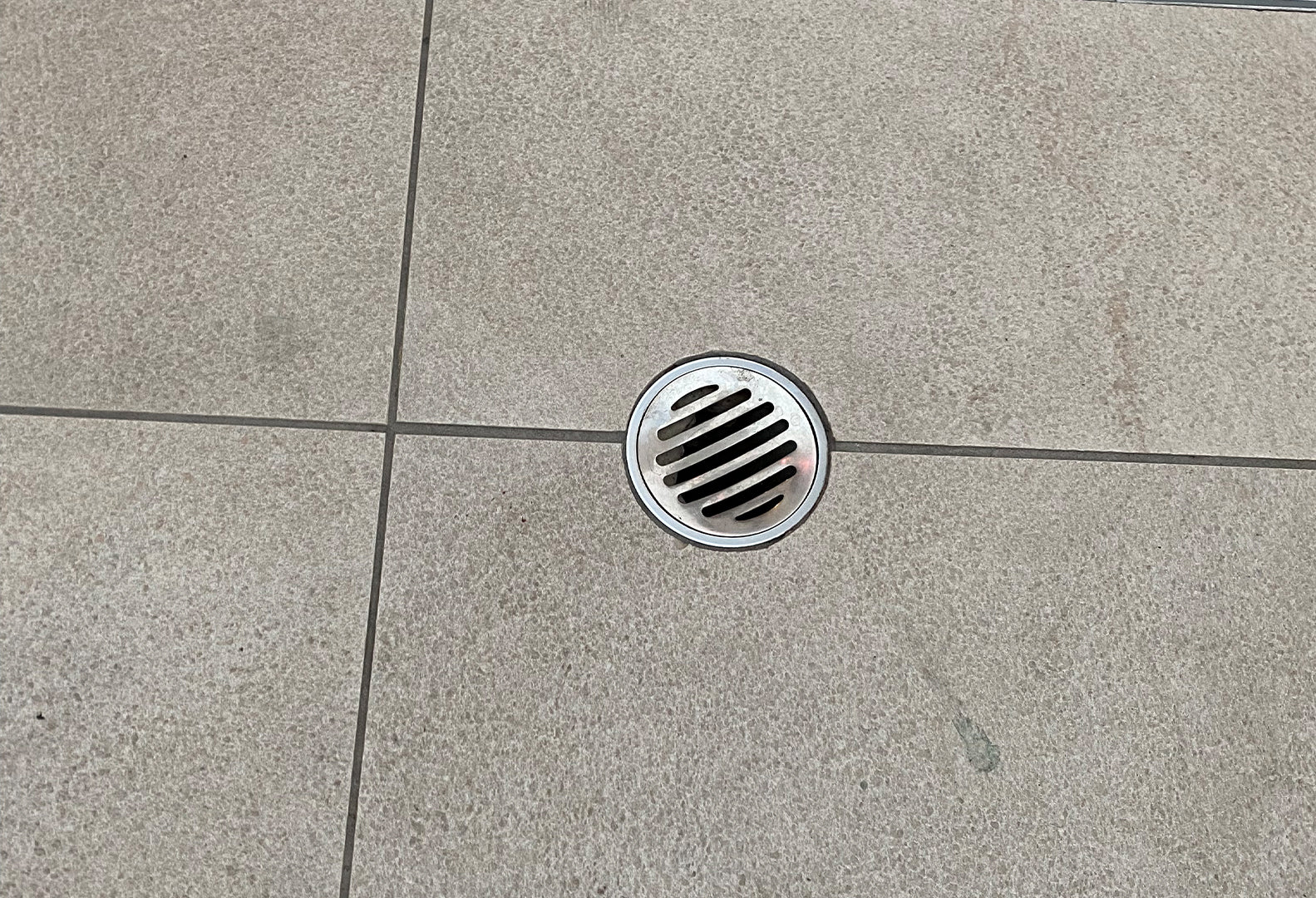 Metal drain grate before