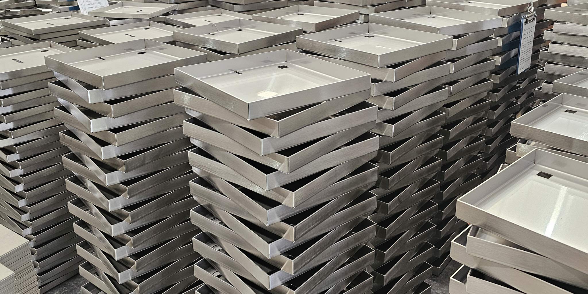 Stainless Steel HIDE Lids stacked in our Yatala manufacturing facility. Showcasing how we have lots of stock.