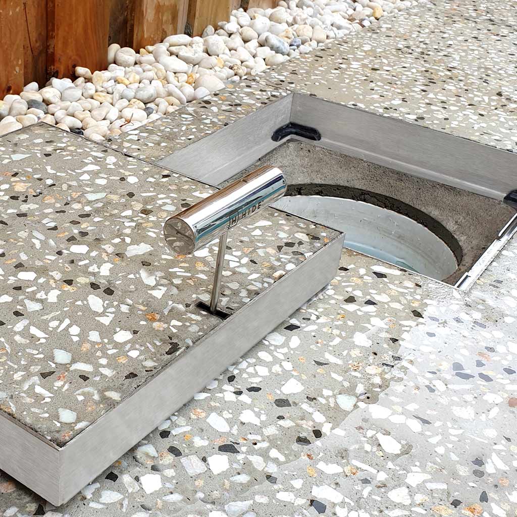 HIDE Concrete Cover installed with honed concrete exposing the aggregate stone.