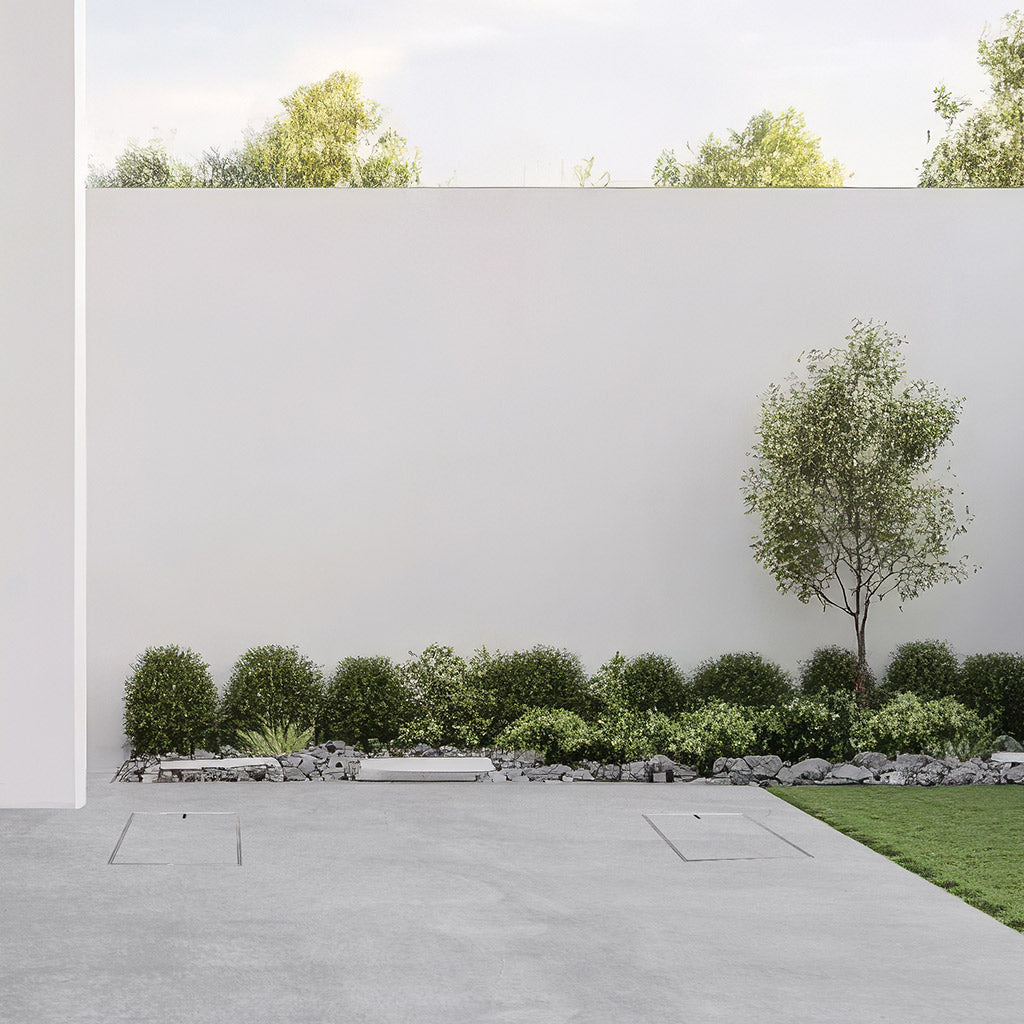 Two HIDE Concrete Access Covers installed with wet-pour concrete, installed flush with surrounding concrete finish