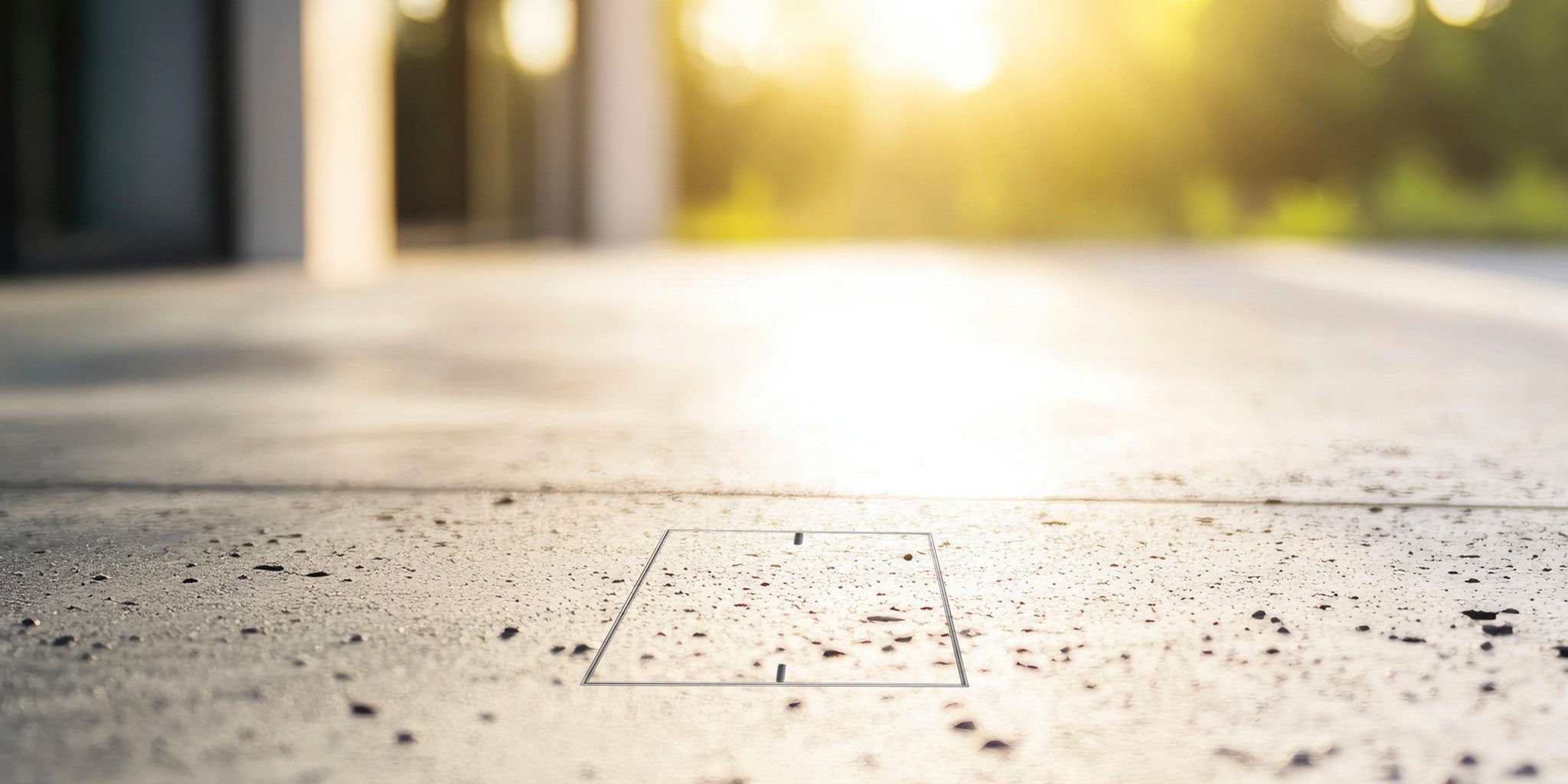 HIDE inlay access cover installed flush in a concrete slab for a seamless finish.