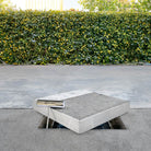 Product photo of HIDE Access Cover on top of edge protector frame with safety key