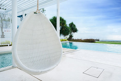 HIDE Access Cover under patio with white paving inlay.